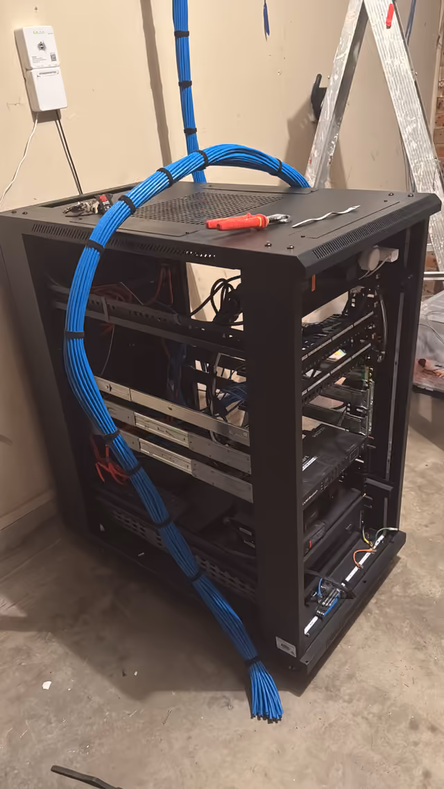 Structured cabling and 22RU rack install after relocating to a new property.