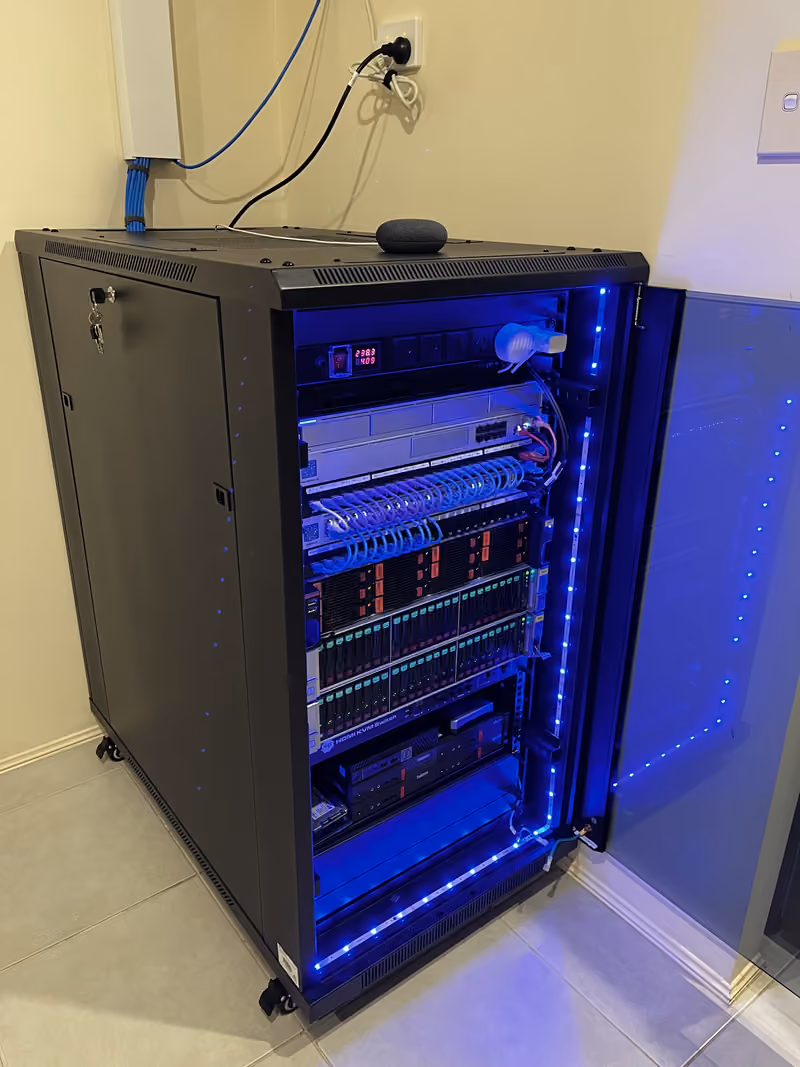 Angled view of the illuminated rack, showing its side panel and labelled patching.