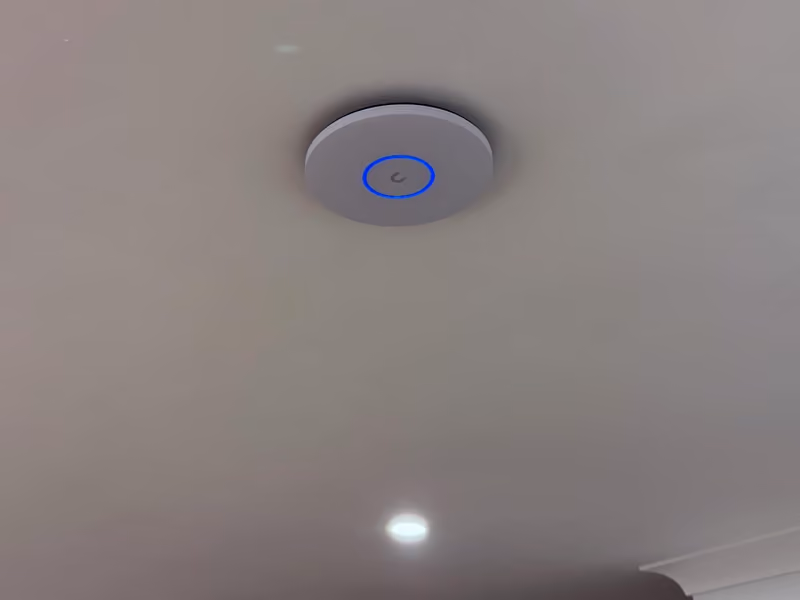 UniFi Pro XG Wi-Fi 7 access point installed.